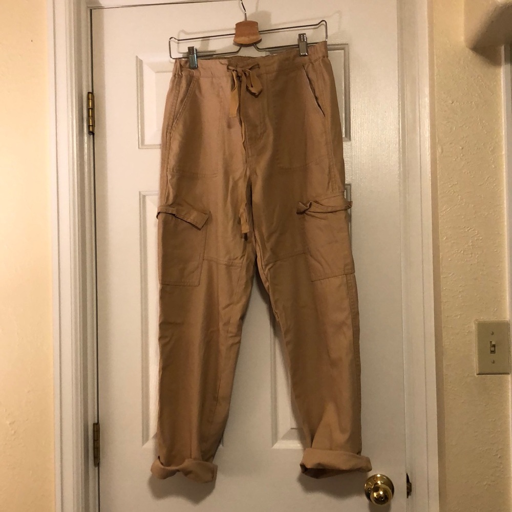 Khaki utilitarian trousers with large pockets